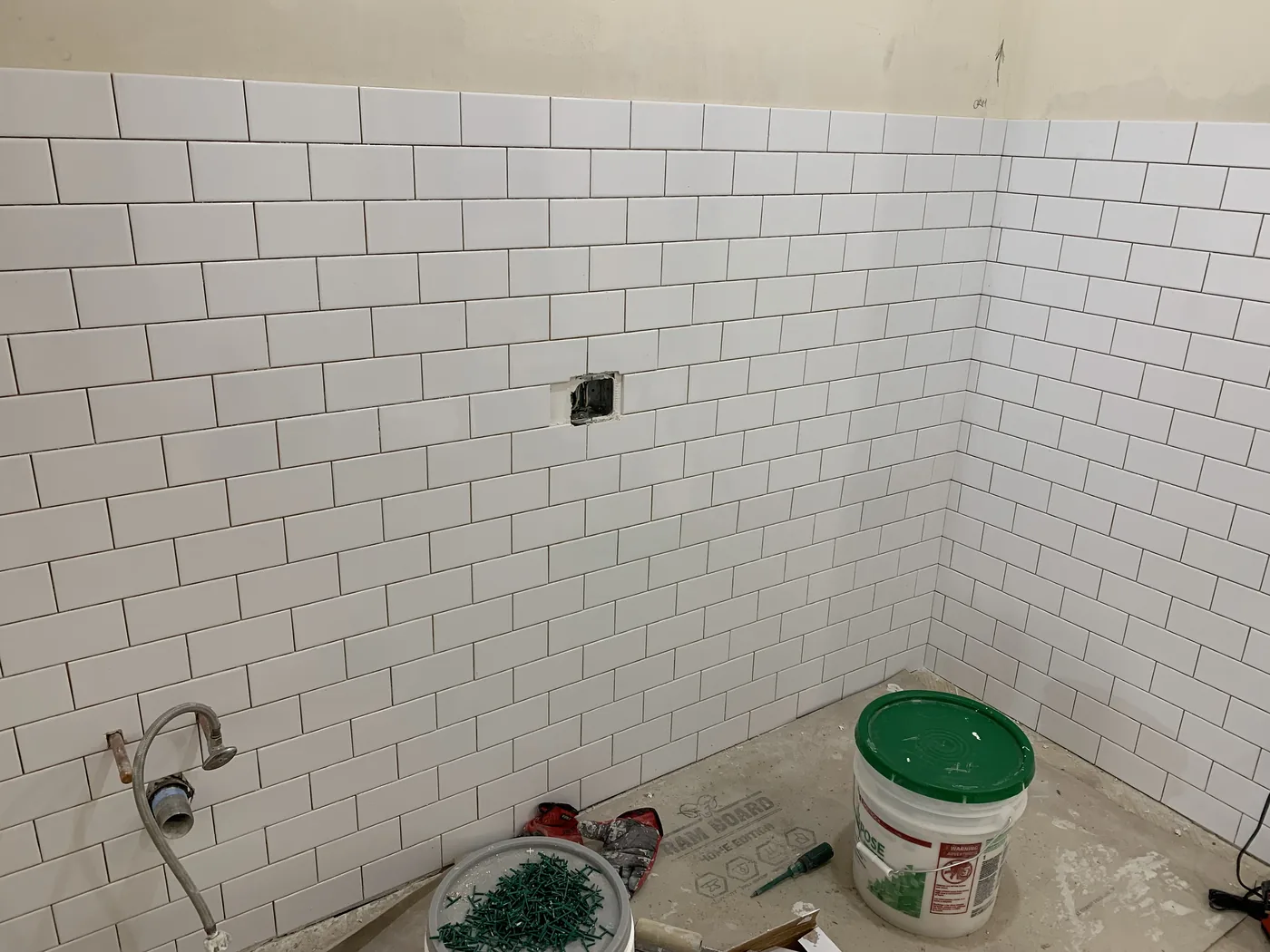 Bathroom tile installation after drywall and surface preparation