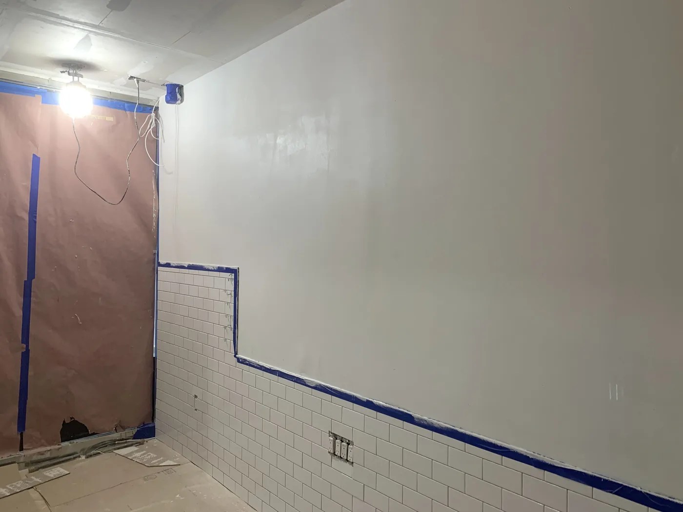 Wall prep and painting progress after drywall repairs