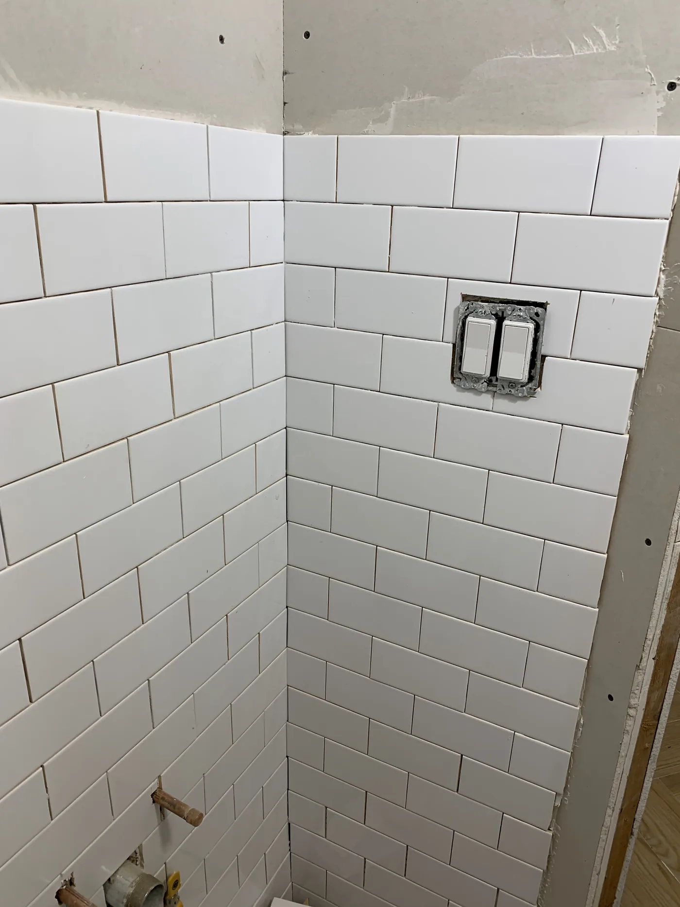 Porcelain floor tile installation in the commercial barbershop space