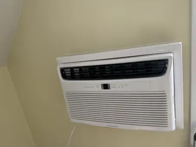Frigidaire window AC unit professionally installed flush in NYC apartment wall