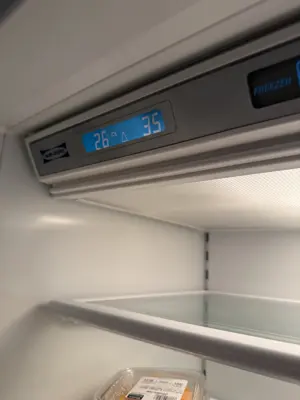 Sub-Zero refrigerator control panel showing normal temperature readings of 26 and 35 after repair in NYC
