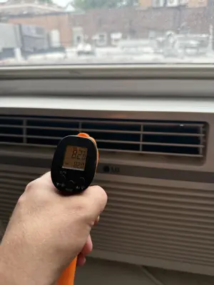 Window AC exterior bracket mounted on NYC building facade