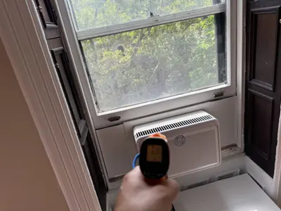 Hisense window AC securely mounted in NYC apartment window