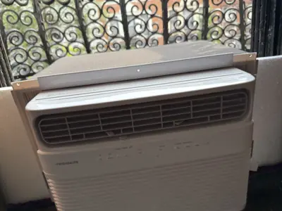 Window AC unit placement and securing — NYC residential