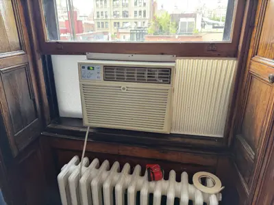 Samsung window AC unit installed with window lock security bar