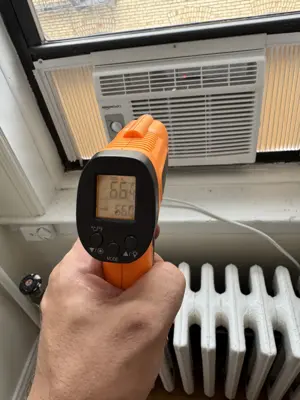 Window AC mounted in bedroom of Brooklyn brownstone