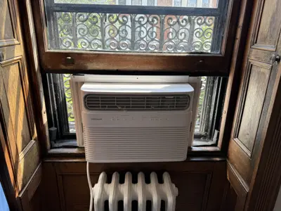 Before and after window AC installation in Queens apartment