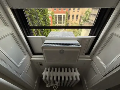 Window AC exterior view after installation, NYC building