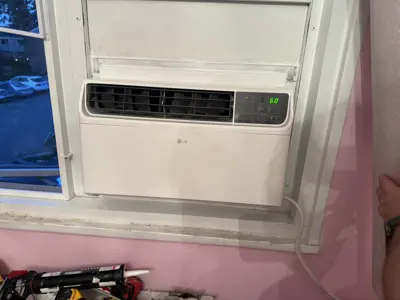 Two window AC units installed simultaneously in NYC apartment