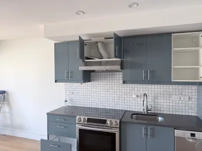 Microwave or range hood installation above stove