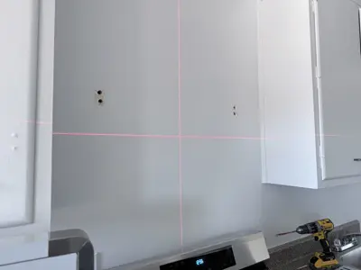 Range hood installation above kitchen stove