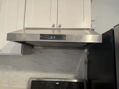 Microwave or range hood installation above stove
