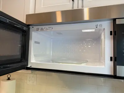 Microwave or range hood installation above stove
