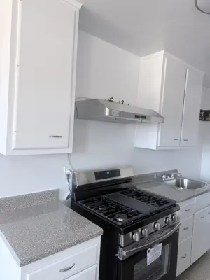 Range hood installation above kitchen stove