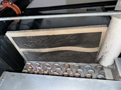 Heavily clogged and dirty HVAC or refrigeration air filter removed during commercial appliance service in NYC