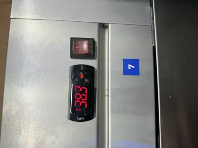 Commercial refrigerator digital temperature controller displaying 38.3°F after repair in NYC