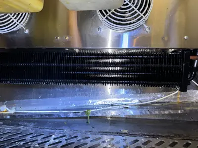 Clean condenser coils on commercial refrigeration unit after professional servicing and maintenance in NYC