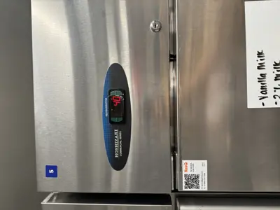 Hoshizaki commercial stainless steel refrigerator digital display showing 44°F temperature reading