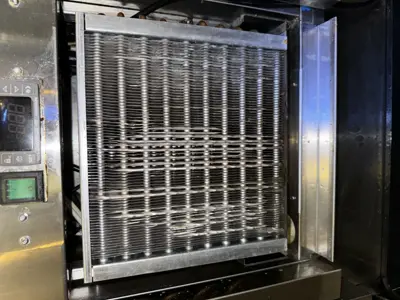 Clean commercial refrigerator condenser coil after professional cleaning service by NYC handyman team