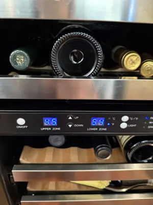 Dual-zone wine cooler installed and operating with temperature display in NYC home