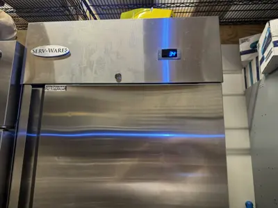 Serv-Ware commercial stainless steel refrigerator serviced and running at 34°F by NYC handyman team