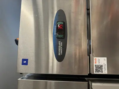 Hoshizaki commercial refrigerator unit number 5 showing stable 35°F temperature after repair in NYC
