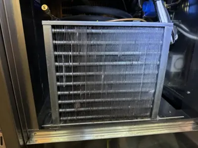 Close-up of clean commercial refrigeration condenser coil after professional cleaning service in NYC