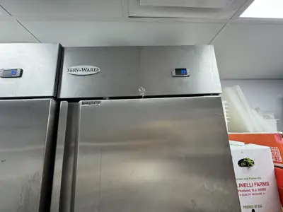 Serv-Wares commercial stainless steel refrigerator serviced and running in a NYC commercial kitchen