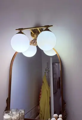 Chandelier installation — decorative light fixture hung and wired