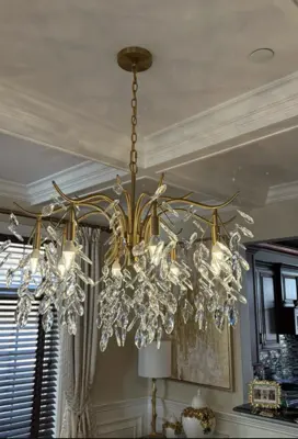 Chandelier installation — decorative light fixture hung and wired