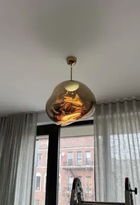 Chandelier installation — decorative light fixture hung and wired