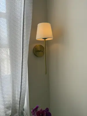 Light fixture installation — new fixture wired and mounted