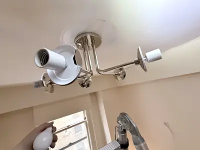 Light fixture replacement — old fixture removed and new one installed