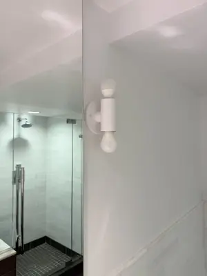 Light fixture installation — new fixture wired and mounted