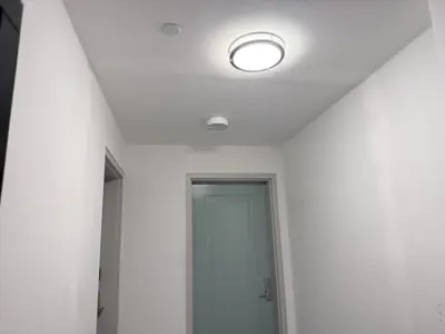 Light fixture installation — new fixture wired and mounted