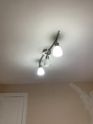 Light fixture installation — new fixture wired and mounted