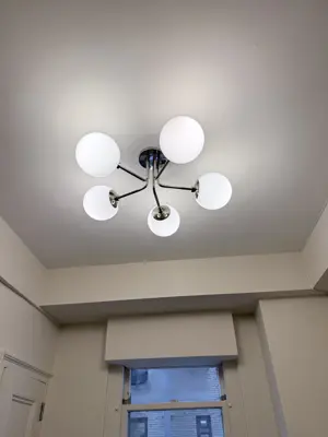 Light fixture replacement — old fixture removed and new one installed