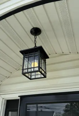 Light fixture installation — new fixture wired and mounted