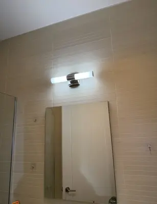 Light fixture installation — new fixture wired and mounted