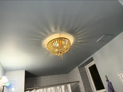 Light fixture installation — new fixture wired and mounted