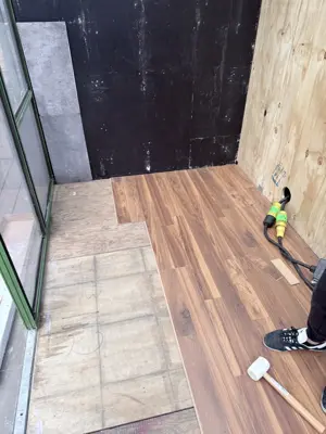 Click-lock flooring installation in a NYC apartment