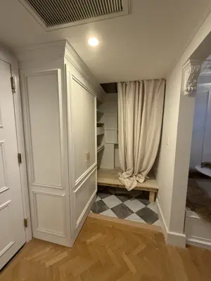 IKEA PAX wardrobe installation with custom cornice molding and Murphy bed