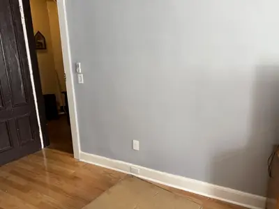 Wall prepared for Murphy bed installation — before photo