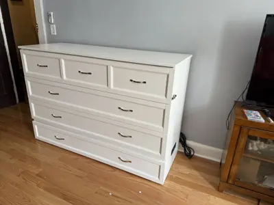 Completed Murphy bed assembly with integrated storage drawers