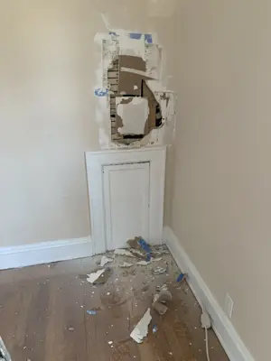 Drywall repair — damaged wall restored and patched