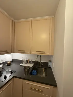 Freshly painted kitchen cabinets with newly installed cabinet handles