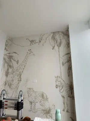 Professional wallpaper installation on interior walls