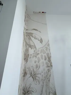 Professional wallpaper installation on interior walls