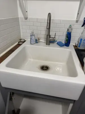 Faucet replacement — old faucet removed, new one installed