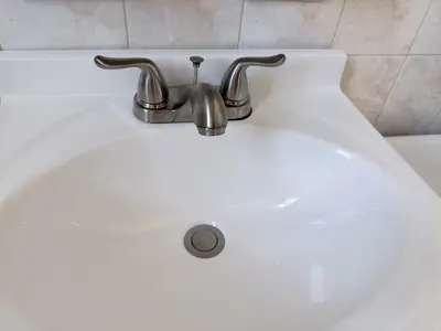 New faucet installation with plumbing connection